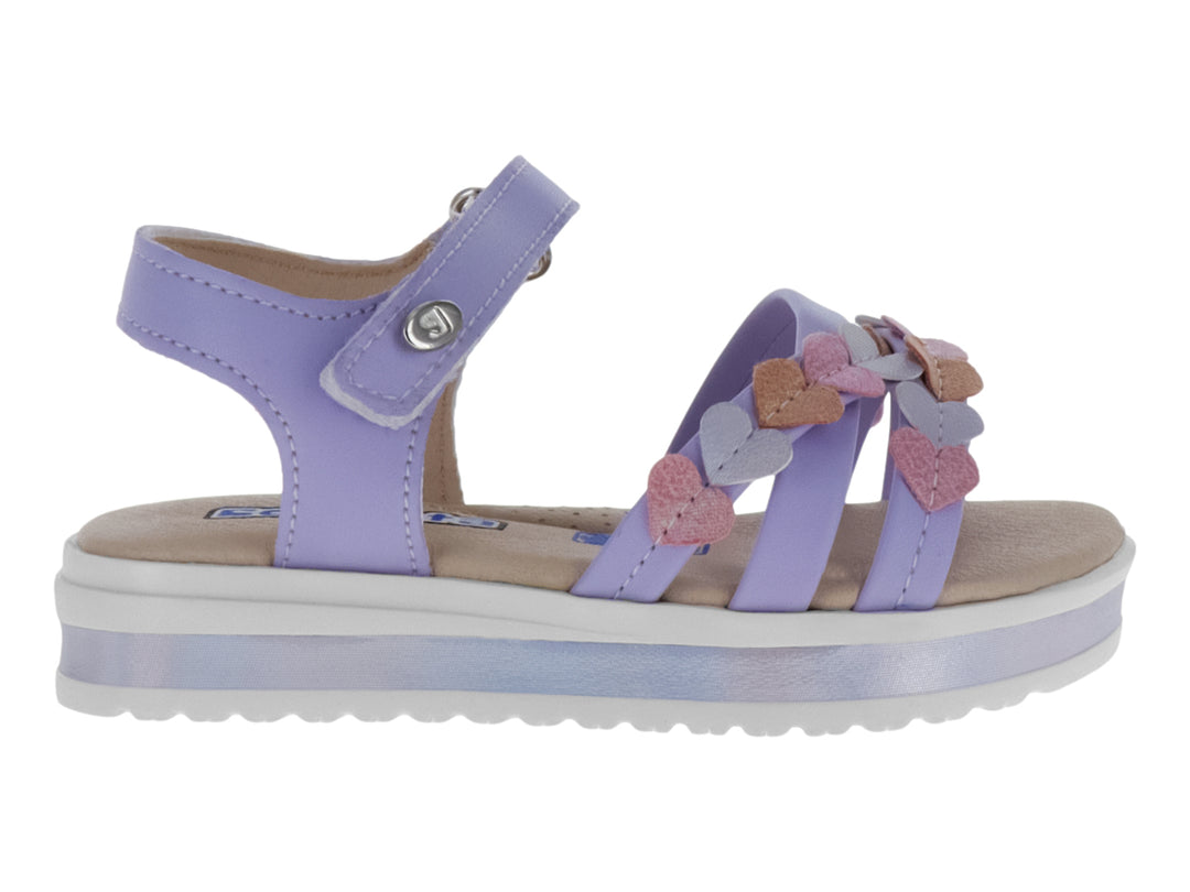 Sandalias lila para niña con plataforma blanca y adornos de corazones en tonos rosa y lila.