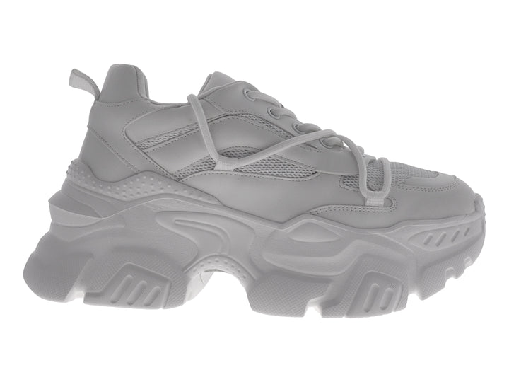 Tenis blancos de plataforma estilo chunky con suela robusta y detalles de malla.