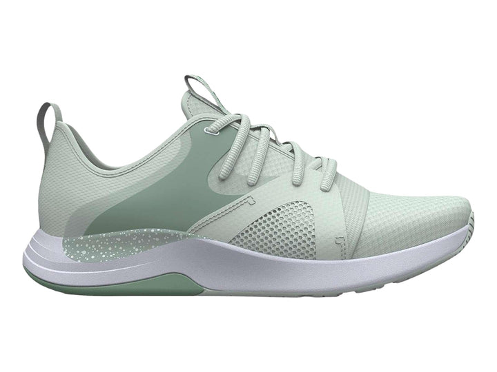 Tenis deportivos Under Armour color verde claro con suela blanca y malla transpirable.