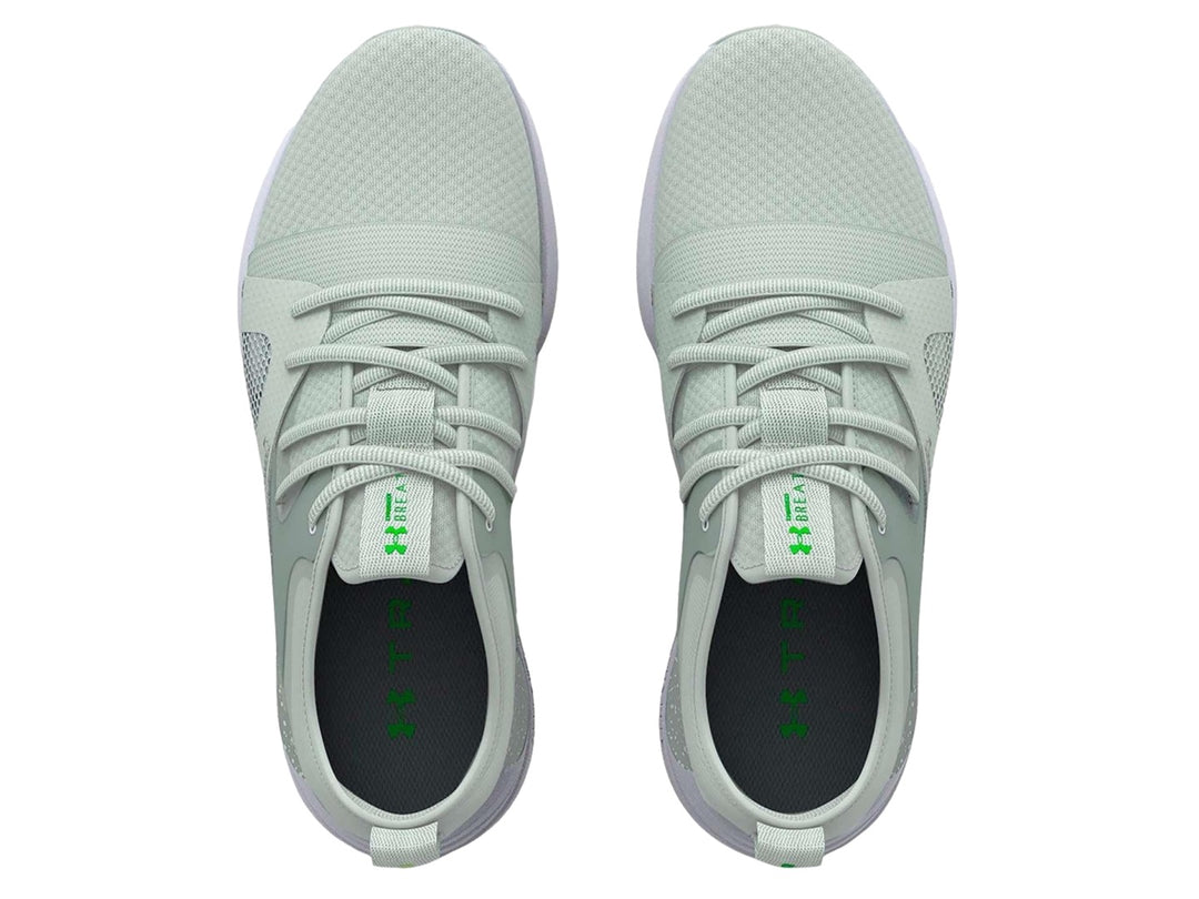 Tenis deportivos Under Armour color verde claro con suela blanca y malla transpirable.