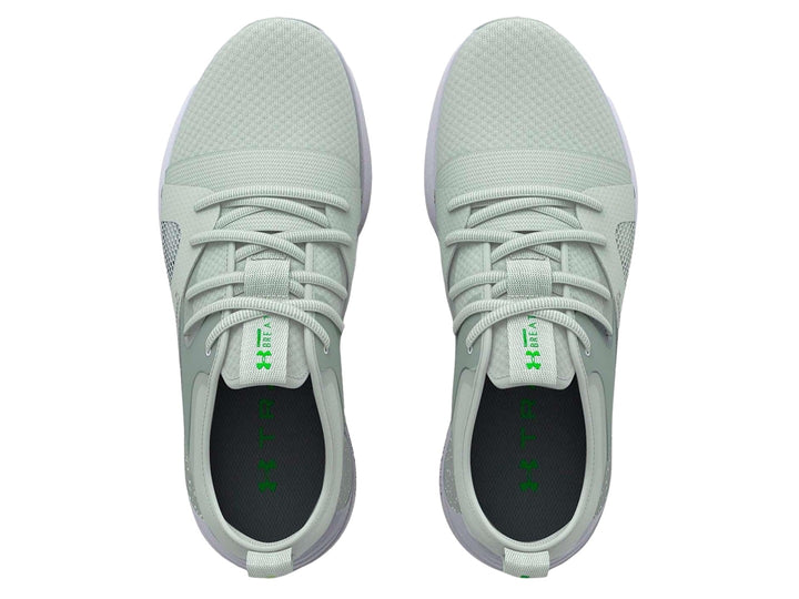 Tenis deportivos Under Armour color verde claro con suela blanca y malla transpirable.