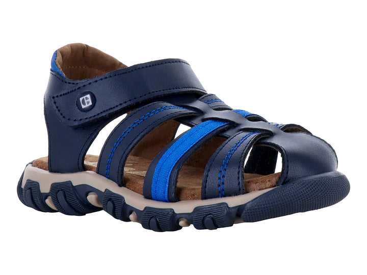 Sandalia infantil color azul marino con suela beige y correas ajustables.