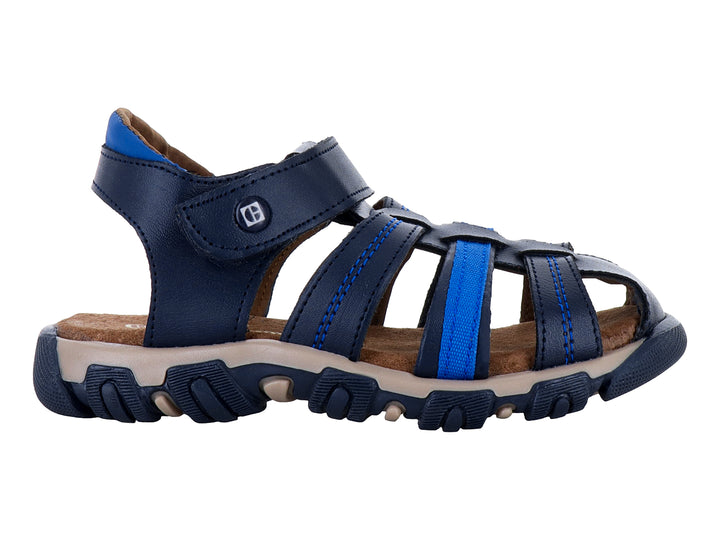 Sandalia infantil color azul marino con suela beige y correas ajustables.