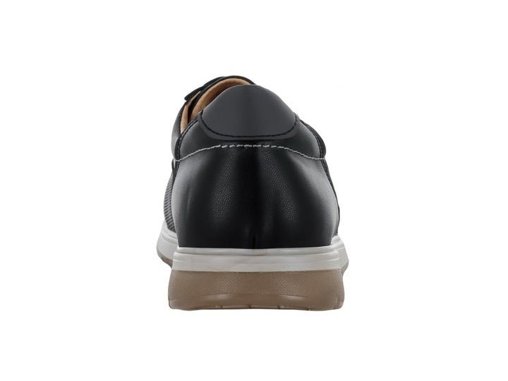 Zapato casual color negro para hombre con cordones y suela blanca y café.
