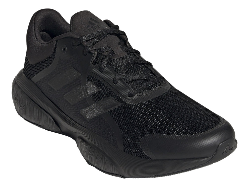 Tenis deportivos Adidas GX2000 en color negro total, vista lateral sobre fondo blanco.