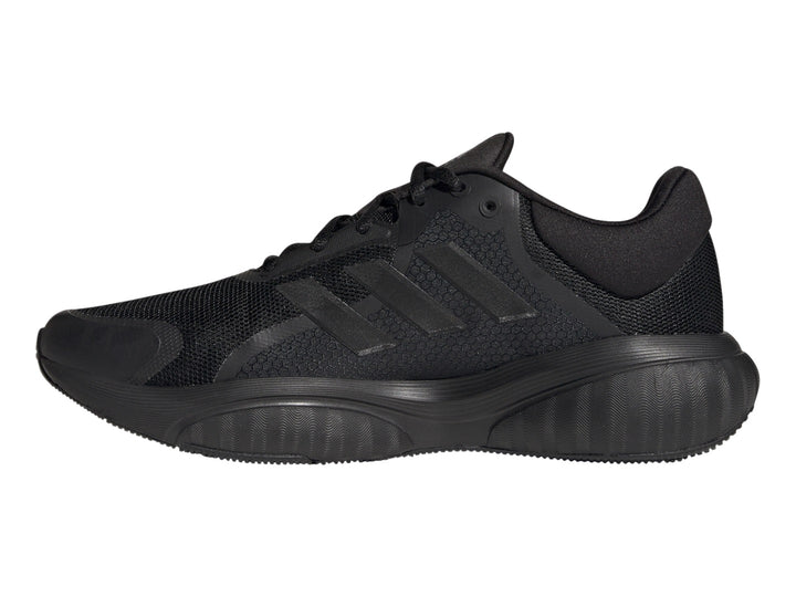 Tenis deportivos Adidas GX2000 en color negro total, vista lateral sobre fondo blanco.
