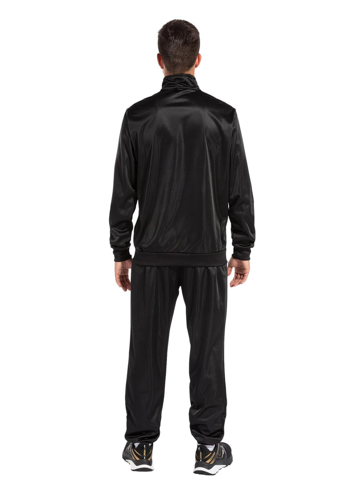Conjunto deportivo Joma para niño en color negro con detalle blanco en la chaqueta.