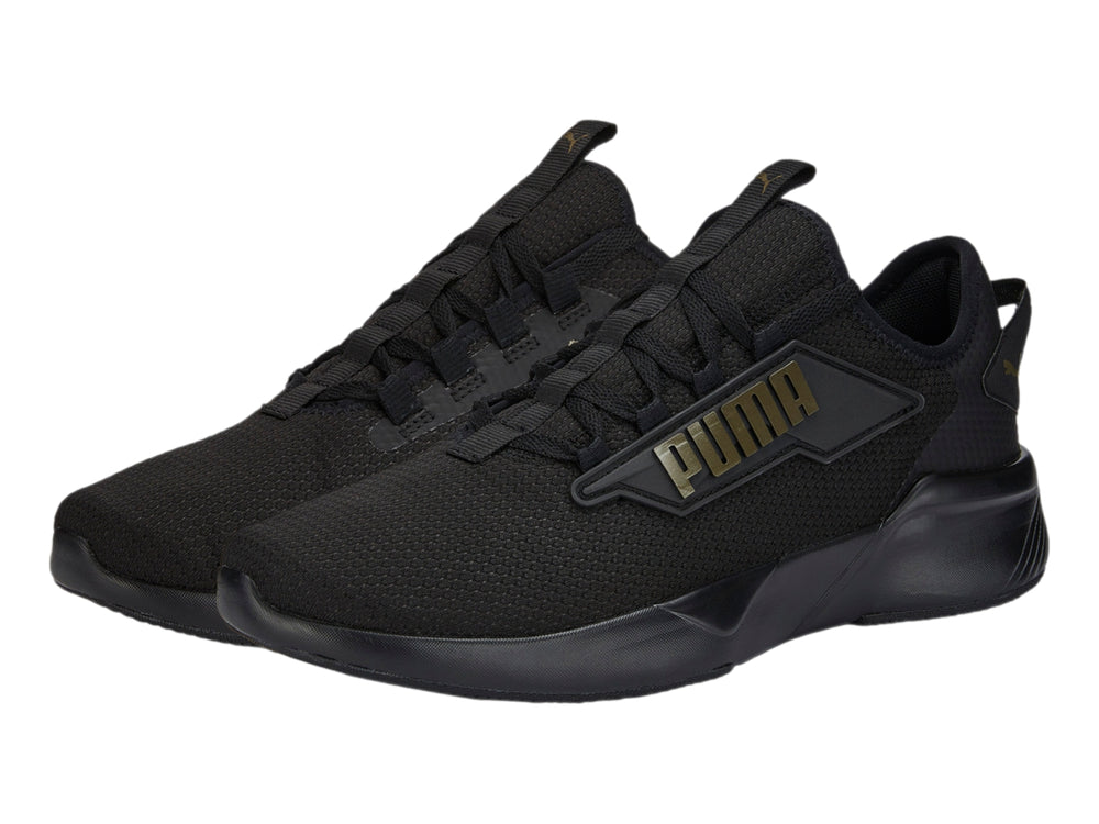 Tenis PUMA Retaliate 2 color negro con diseño deportivo y malla transpirable.