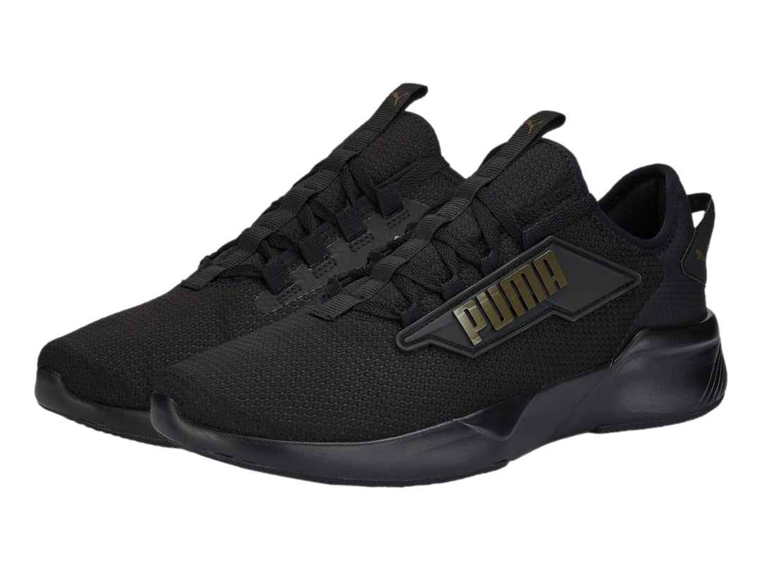Tenis PUMA Retaliate 2 color negro con diseño deportivo y malla transpirable.