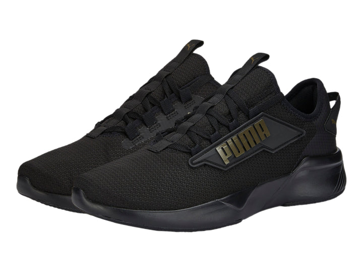 Tenis PUMA Retaliate 2 color negro con diseño deportivo y malla transpirable.