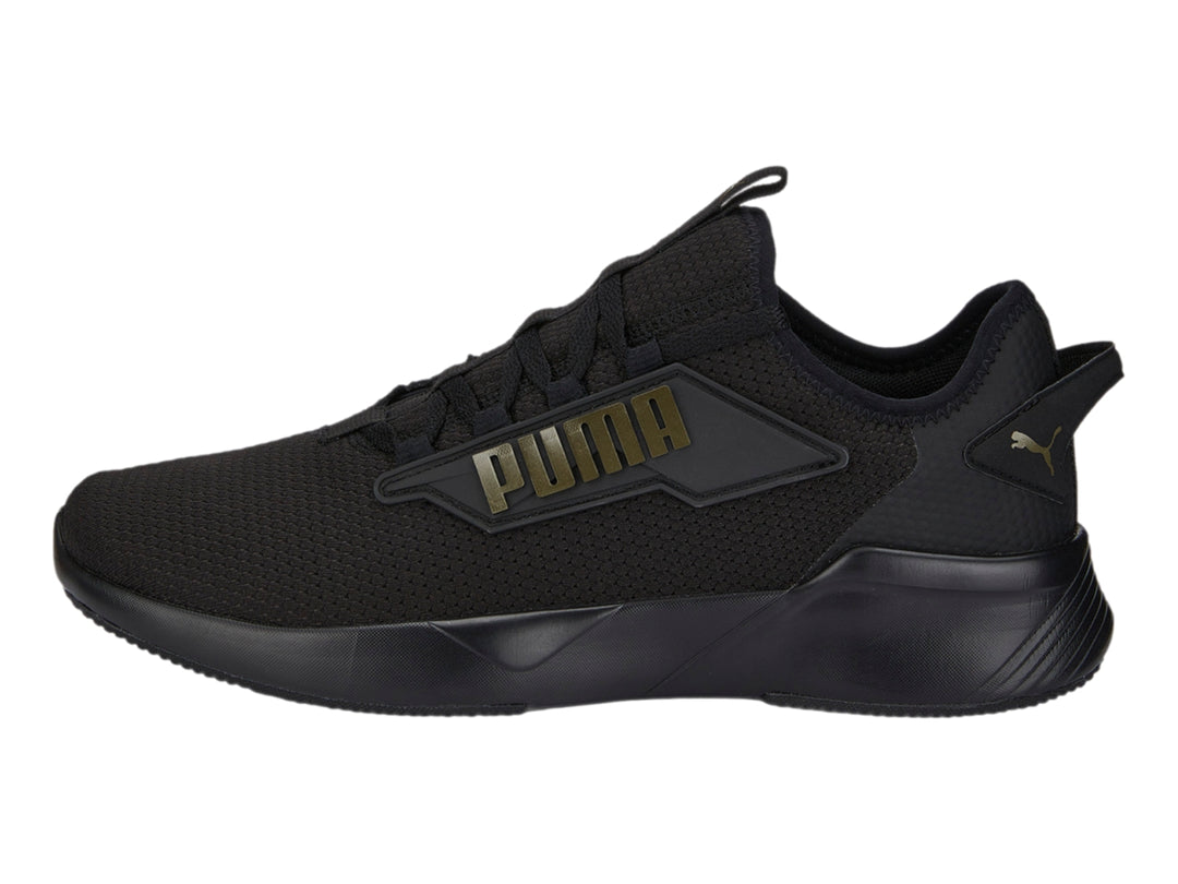 Tenis PUMA Retaliate 2 color negro con diseño deportivo y malla transpirable.
