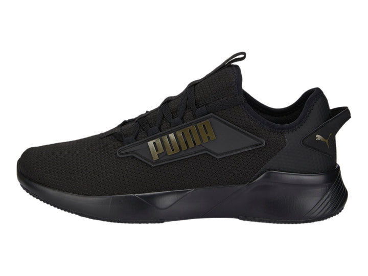 Tenis PUMA Retaliate 2 color negro con diseño deportivo y malla transpirable.
