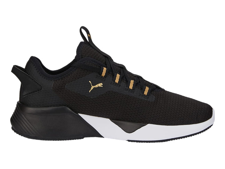 Tenis deportivos PUMA Retaliate 2 color negro con suela blanca y detalles dorados.