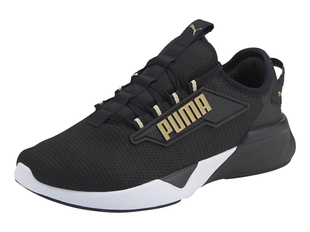 Tenis deportivos PUMA Retaliate 2 color negro con suela blanca y detalles dorados.