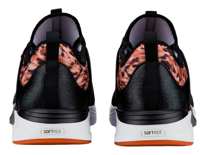 Tenis PUMA negros con detalles en animal print dorado y suela blanca para mujer.