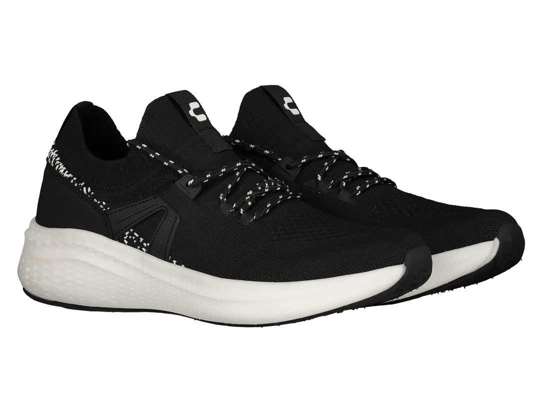 Tenis deportivos Charly color negro con suela blanca y tejido transpirable.
