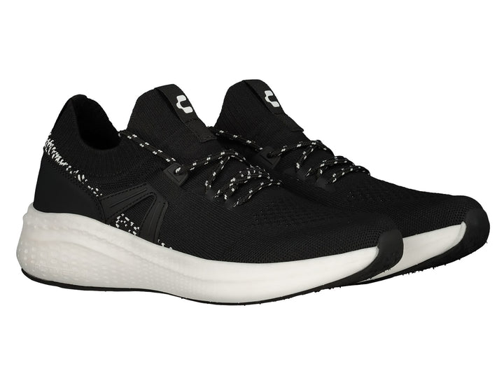 Tenis deportivos Charly color negro con suela blanca y tejido transpirable.
