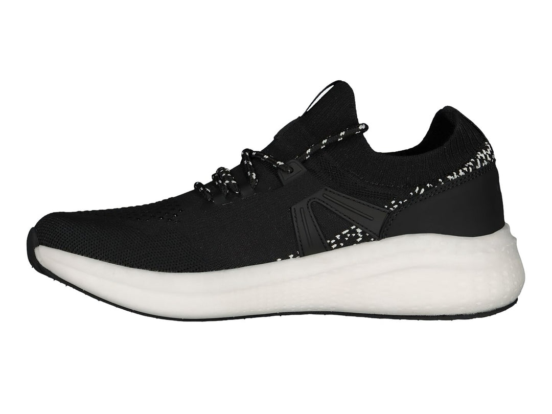 Tenis deportivos Charly color negro con suela blanca y tejido transpirable.