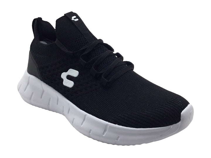 Tenis deportivos Charly color negro con suela blanca y tejido transpirable.