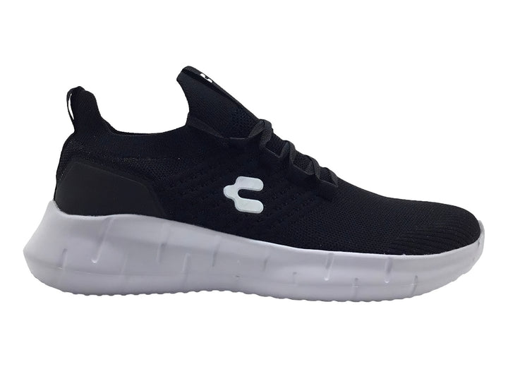 Tenis deportivos Charly color negro con suela blanca y tejido transpirable.