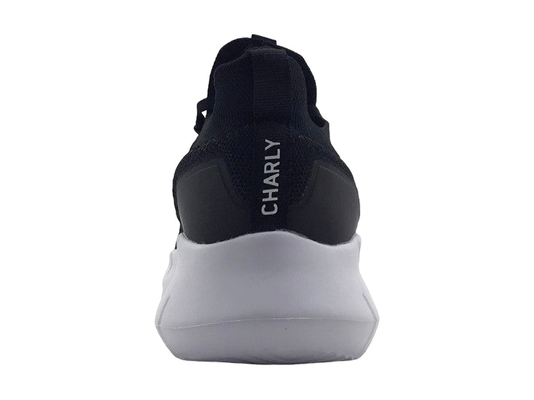 Tenis deportivos Charly color negro con suela blanca y tejido transpirable.