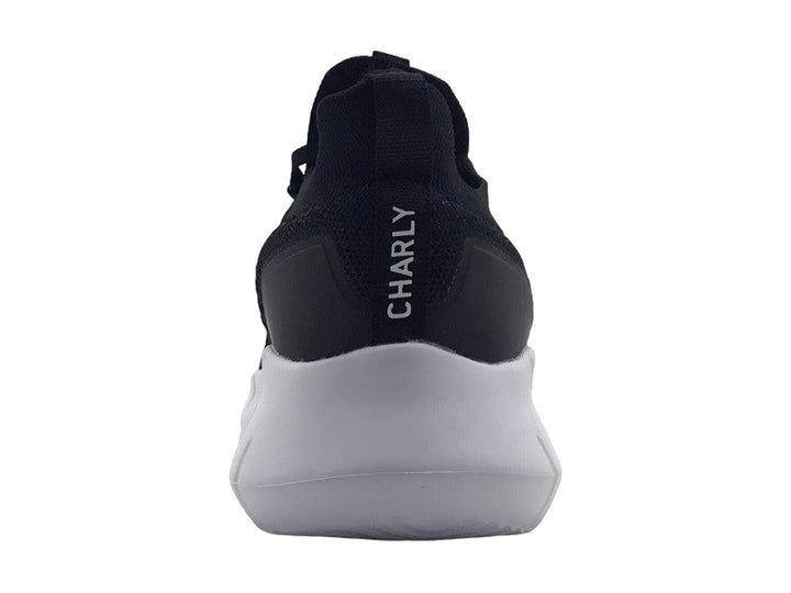 Tenis deportivos Charly color negro con suela blanca y tejido transpirable.