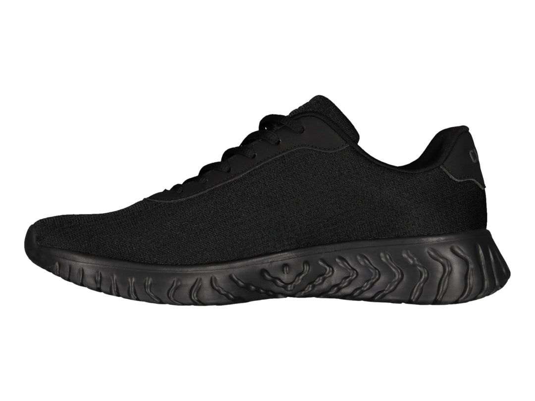 Tenis deportivos Charly color negro con suela ondulada y tejido transpirable.