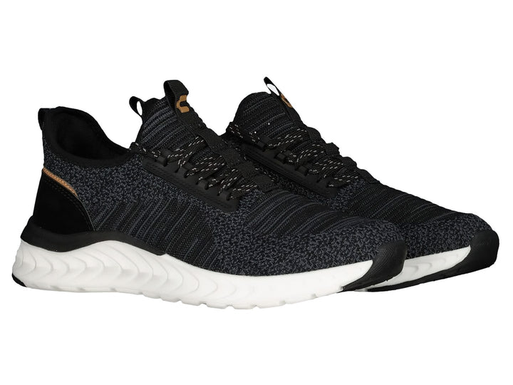Tenis deportivos Charly color negro con suela blanca y detalles cafés.