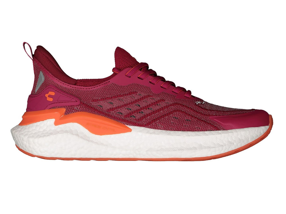 Par de tenis deportivos Charly en color fucsia con suela blanca y detalles en naranja.