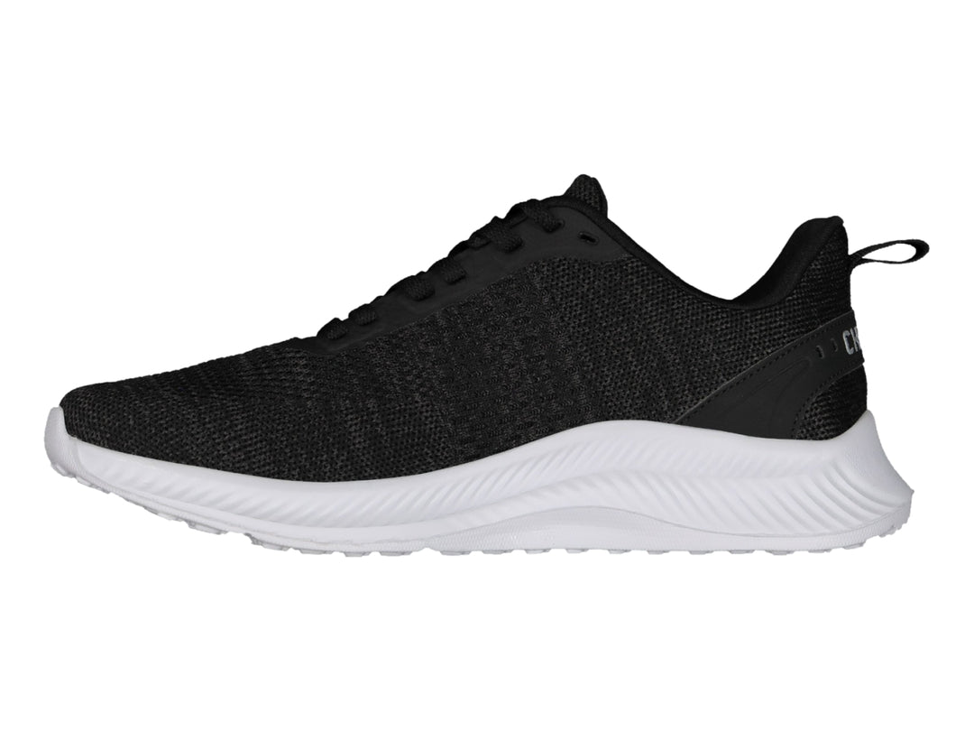 Tenis deportivos Charly color negro con suela blanca y logotipo lateral blanco.
