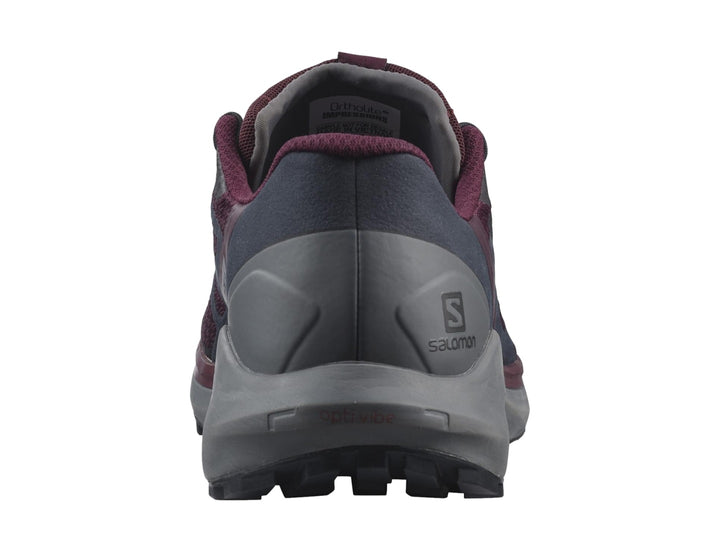 Tenis deportivos Salomon Sense Ride 4 en color vino y gris con suela para trail running.