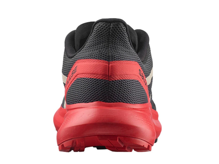 Tenis deportivos Salomon Hypulse en colores gris, rojo y negro con suela amortiguada.