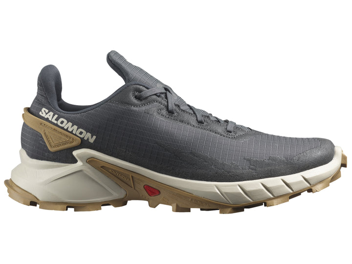 Tenis deportivos Salomon Alphacross en color gris oscuro con suela beige y detalles en blanco.