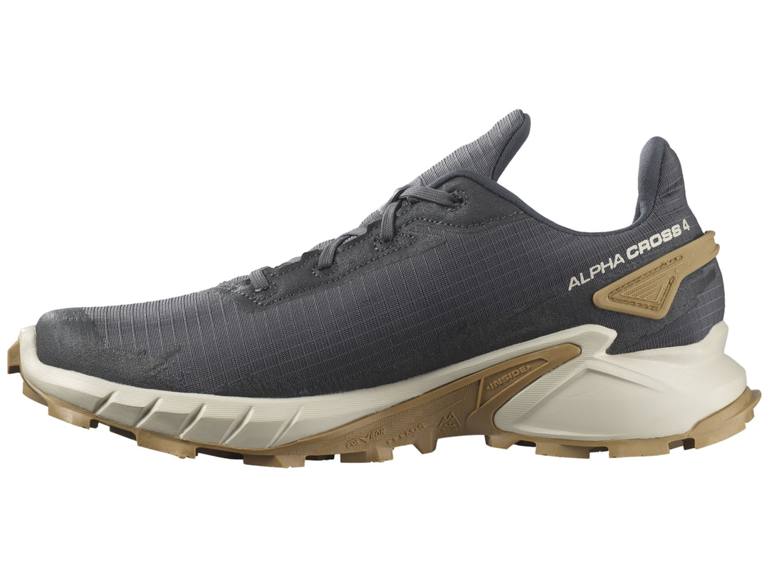 Tenis deportivos Salomon Alphacross en color gris oscuro con suela beige y detalles en blanco.