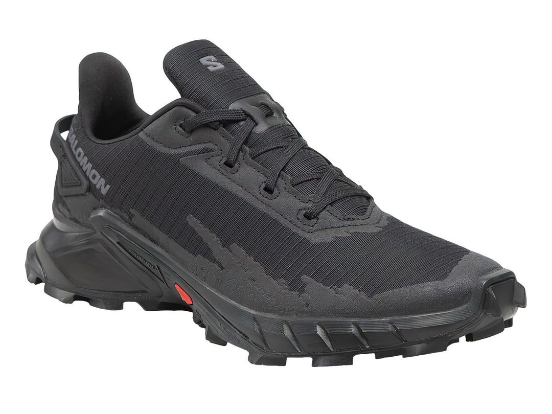 Tenis deportivos Salomon Alphacross en color negro con suela robusta y un pequeño detalle rojo lateral.