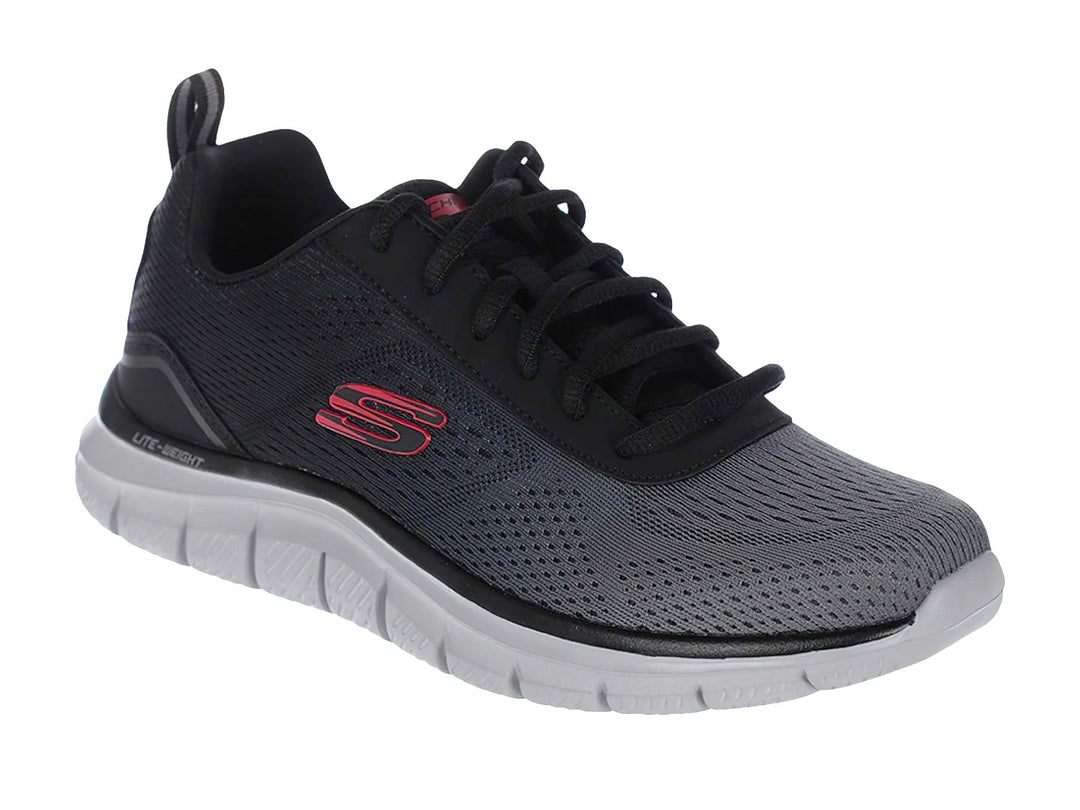 Zapato deportivo Skechers Track en colores negro y gris con suela blanca ligera.