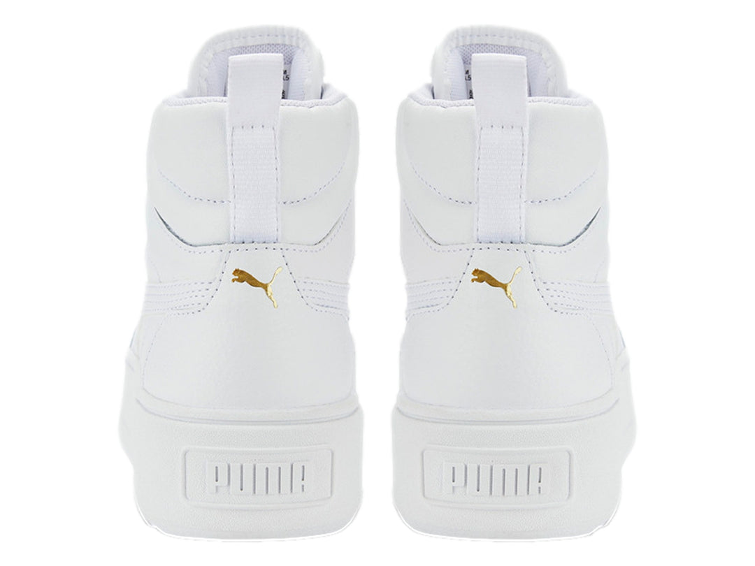 Tenis PUMA Karmen Mid color blanco con suela de plataforma y detalles dorados en los ojetes.