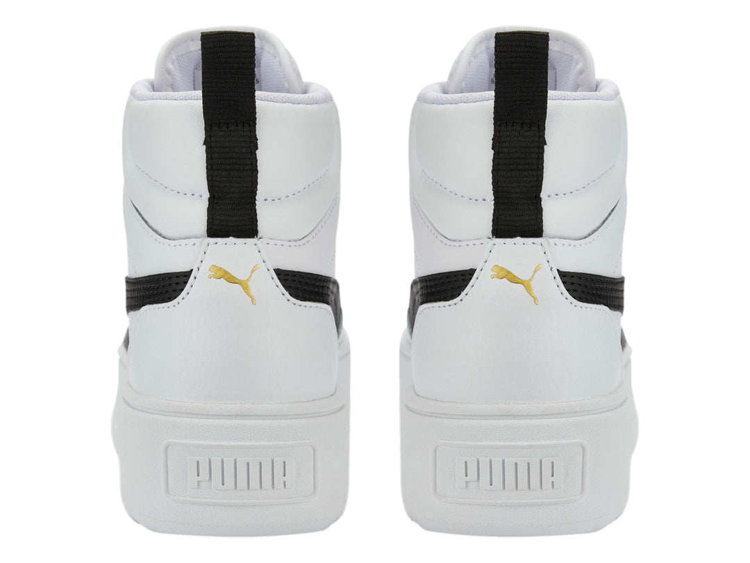 Tenis PUMA Carmen Mid blancos con suela de plataforma y detalle lateral negro.