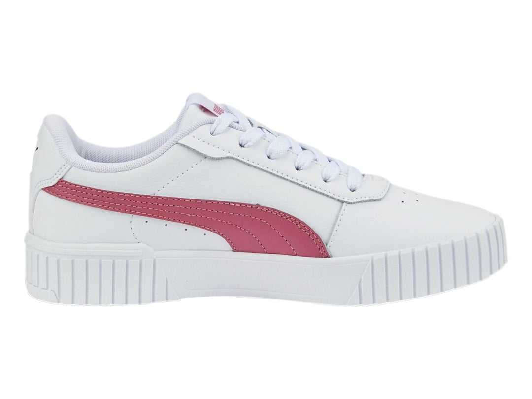 Tenis PUMA Carina 2.0 blancos con franja rosa y suela de plataforma blanca.
