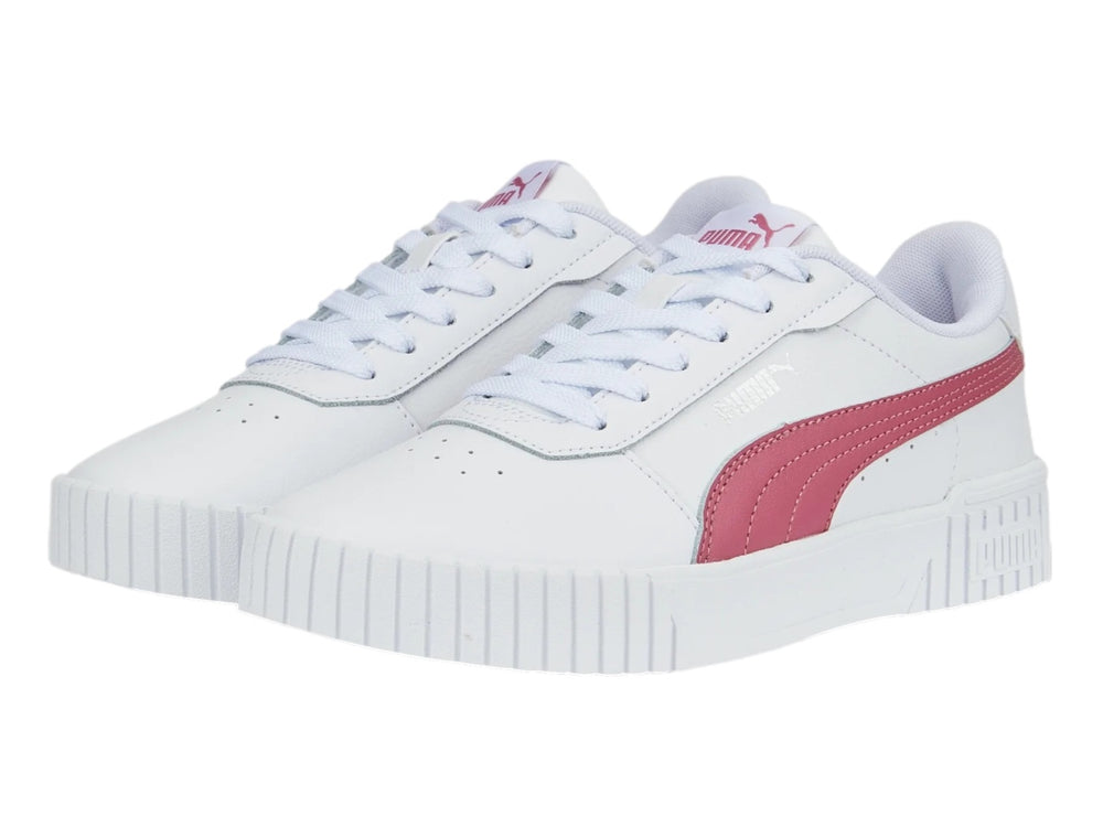 Tenis PUMA Carina 2.0 blancos con franja rosa y suela de plataforma blanca.