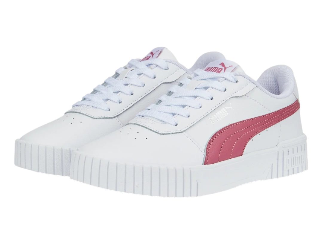 Tenis PUMA Carina 2.0 blancos con franja rosa y suela de plataforma blanca.