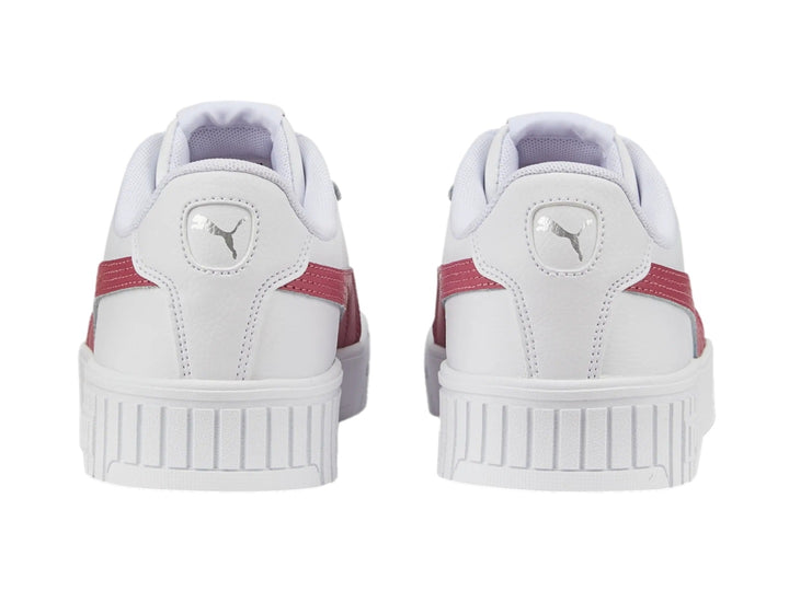 Tenis PUMA Carina 2.0 blancos con franja rosa y suela de plataforma blanca.