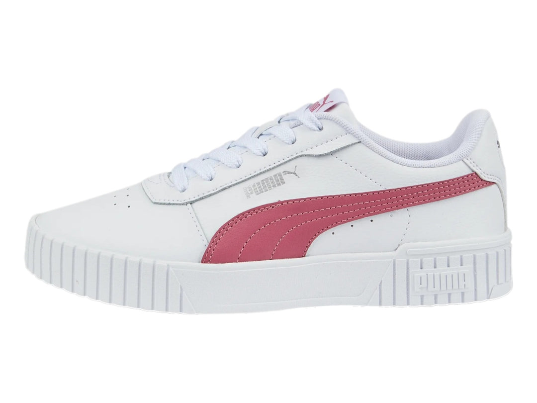 Tenis PUMA Carina 2.0 blancos con franja rosa y suela de plataforma blanca.