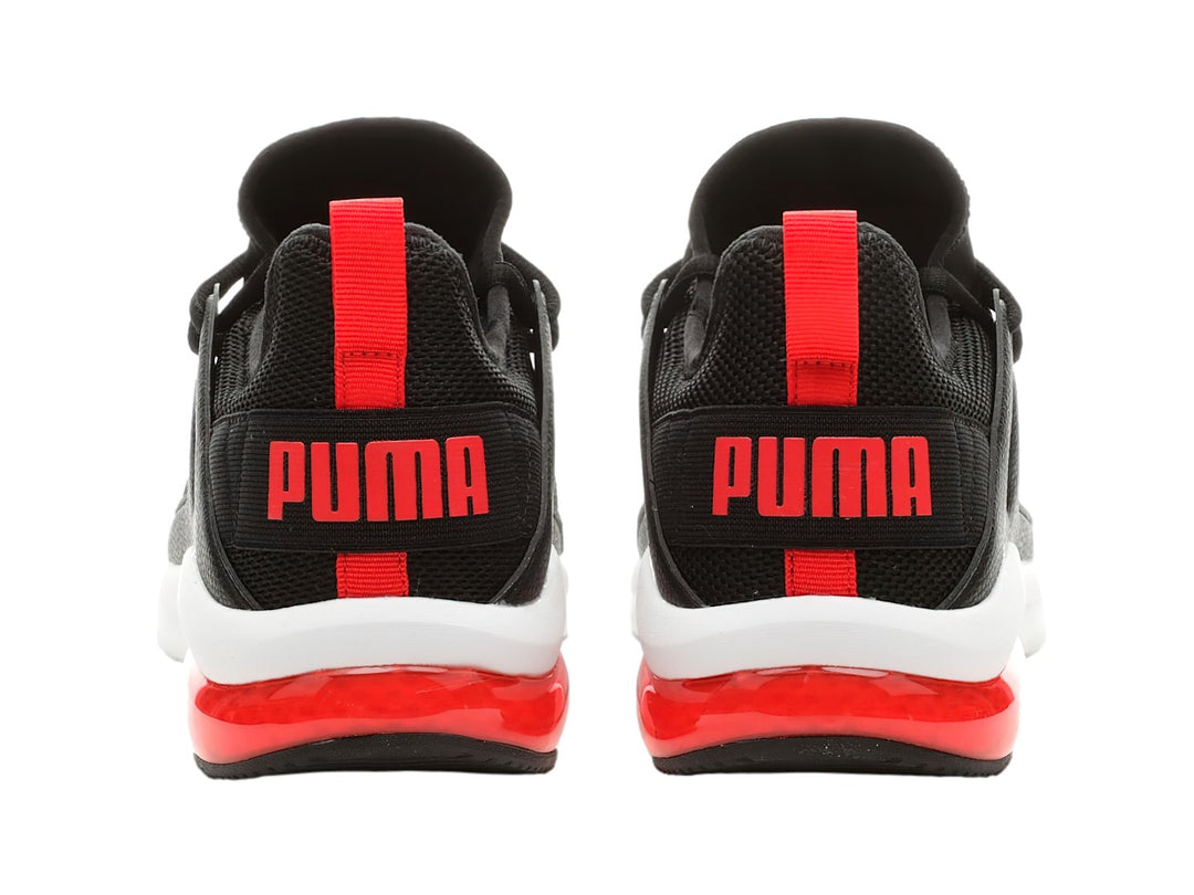 Tenis PUMA Electron 2.0 color negro con suela blanca y detalle rojo en el talón.