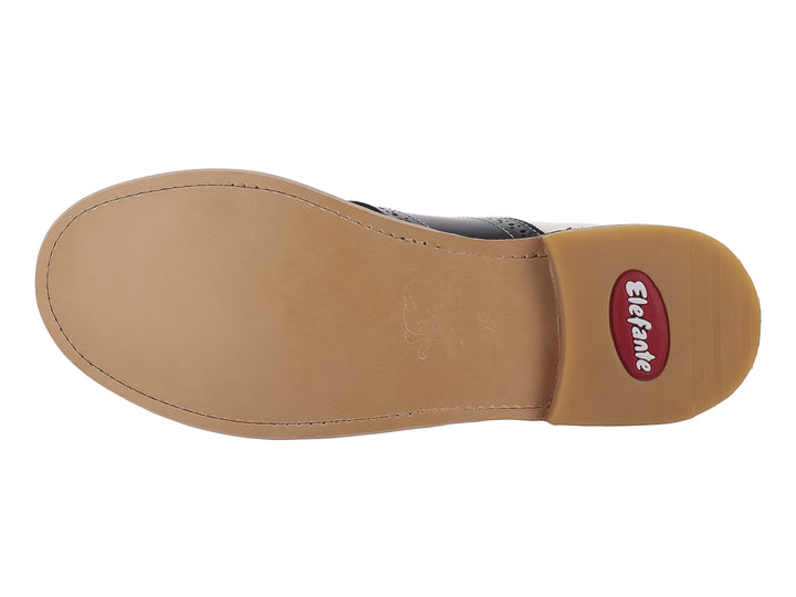 Zapato infantil marca Elefante en colores blanco y negro con agujetas blancas y suela color beige.