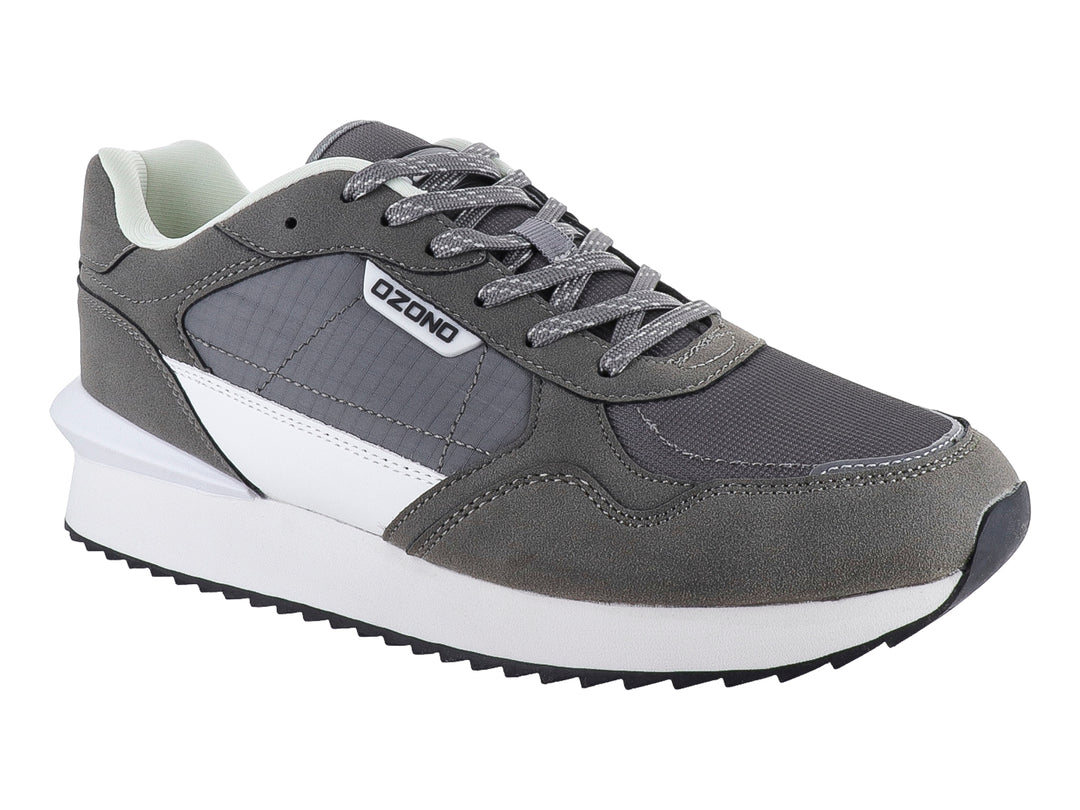 Tenis deportivos marca Capa de Ozono en color gris con detalles blancos y suela blanca.