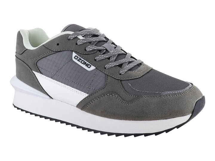 Tenis deportivos marca Capa de Ozono en color gris con detalles blancos y suela blanca.