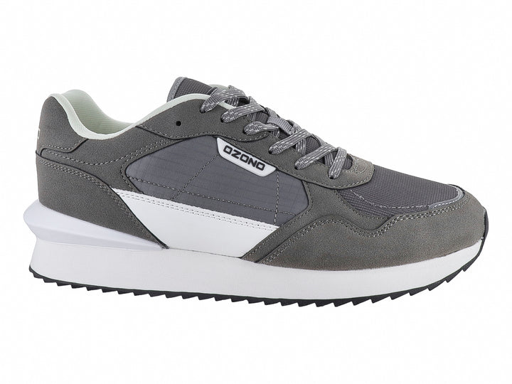 Tenis deportivos marca Capa de Ozono en color gris con detalles blancos y suela blanca.