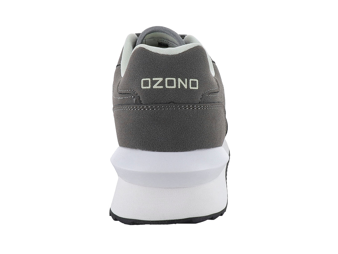 Tenis deportivos marca Capa de Ozono en color gris con detalles blancos y suela blanca.
