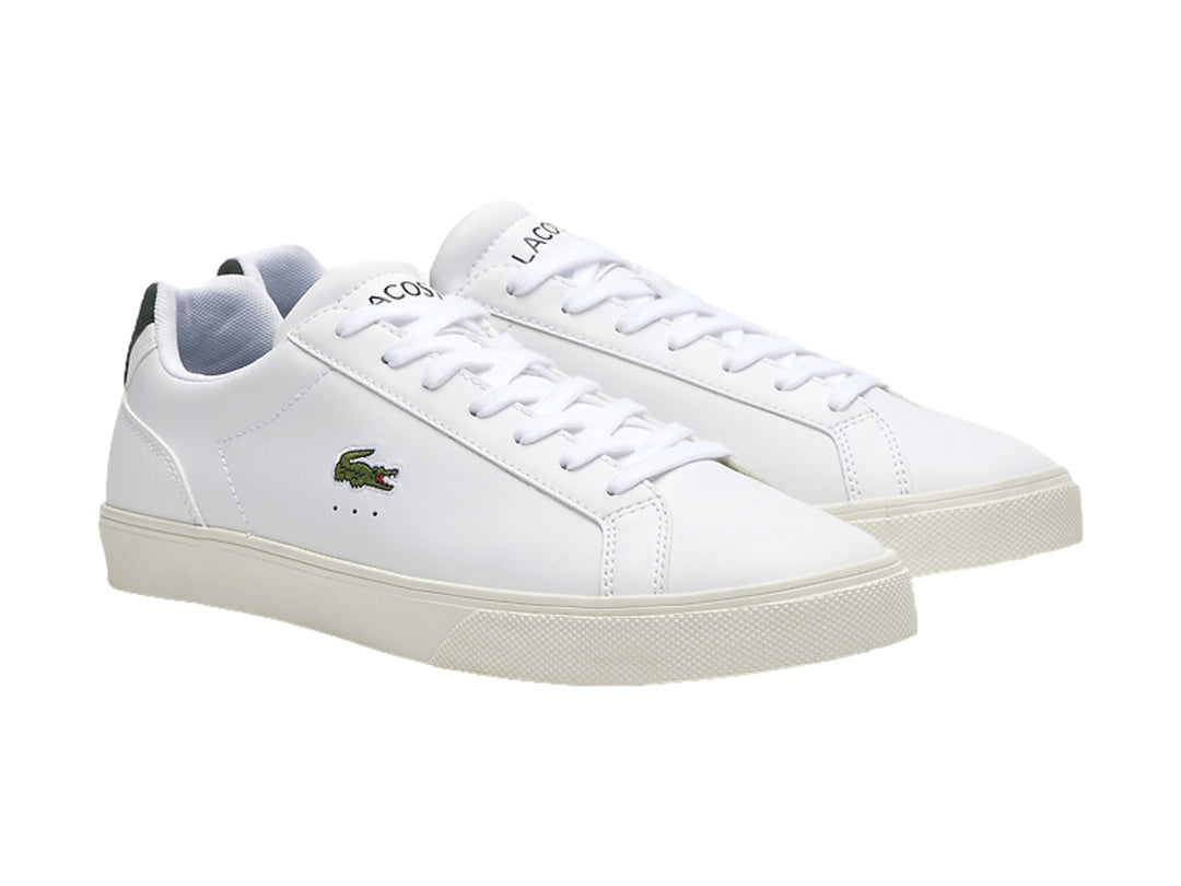 Tenis Lacoste Lerond Pro de cuero blanco con detalle verde en el talón y logotipo del cocodrilo lateral.